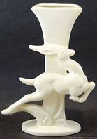 Front view showing gazelle figure and vase profile