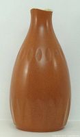 Front view of brown glazed Royal Norfolk vase showing overall form and decorative incisions