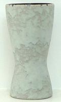 Full front view of hourglass-shaped pale green-grey vase