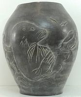 front view showing carved seal and water motif