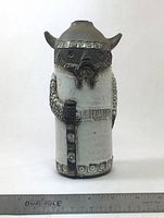 Front view of Viking vase showing full figure and scale ruler