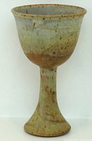 Side view of stoneware goblet showing glaze and shape