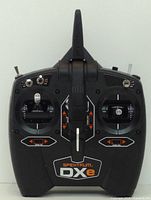 Front view of Spektrum DXe transmitter showing controls and labeling