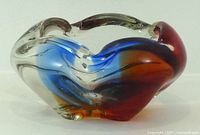 Side profile showing free-form shape and internal colour ribbons