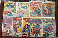 Nine Action Comics issues in sleeves laid out