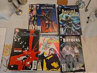 Six Batgirl comics fanned out showing varying cover art and issue numbers