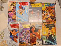 First set of eight Wonder Woman comics displayed face up