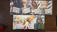 Front covers of volumes 2-8 laid out