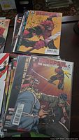 Stack of Deadpool comics with Deadpool #1 and Deadpool & The Mercs for Money #4 visible