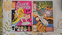 Front covers of Silver Surfer one-shot #1 and issue #34 with Thanos