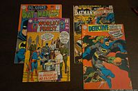 Group shot of four DC Batman-related comic books