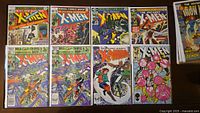 All nine comics laid out showing covers and duplicate #154 variants