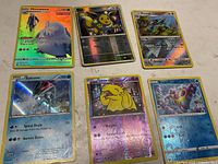 All six reverse-holo Pokémon cards laid out