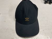 Front view showing gold Trefoil logo and overall condition