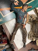 Ash action figure lying on surface