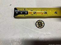 Pin next to tape measure showing size