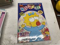 Front cover of Maggie #1 comic book in bag with board