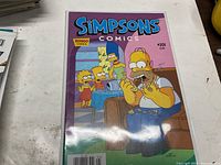 Front cover of Simpsons Comics #201 in protective sleeve