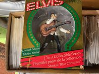 Front of box showing Elvis ornament and series information