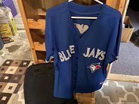 Front view showing Blue Jays logo and button front