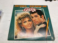 Front cover featuring Travolta and Newton-John