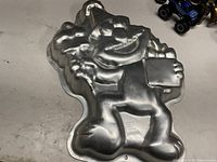 Overall view of Wilton Elmo aluminum cake pan reverse side showing full embossed design