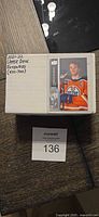 Closed cardboard box labelled 2021-22 Upper Deck Extended (501-700) with sample Connor McDavid card