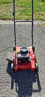 Front view of red push lawn mower showing overall condition