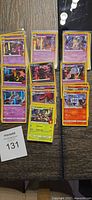 Group shot of 30 Trick or Trade holographic Pokémon cards in three columns, all sleeved