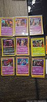 Assorted sleeved Trick or Trade holo cards laid out showing variety