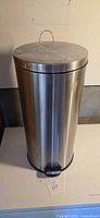 Full view of stainless steel trash can with lid closed