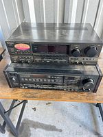 Front view of stacked Technics and Onkyo receivers