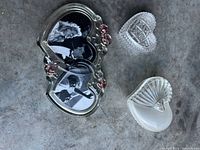 All three items: double-heart glass photo frame with pink roses, cut glass heart dish, pressed glass fan-pattern heart dish
