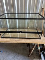 Full view of glass terrarium on bench