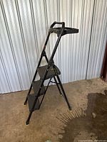 Ladder angled view unfolded showing steps, handrail, tray, rubber feet