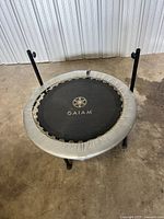 Top view of mini trampoline with two upright stability bar posts attached