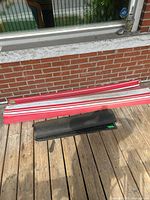 Both carpets rolled and stacked on deck