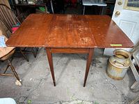Top view of table with both leaves extended showing surface wear and crack