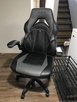 Full front view of Emerge office chair showing seat, armrests and base