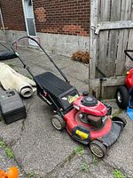 Full side view of mower with grass bag attached