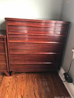 Front view of mahogany dresser showing five drawers
