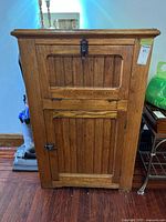 Front view showing full cabinet, doors, hardware and size label