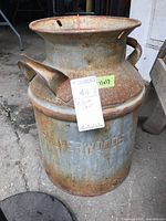 Front view of Silverwoods milk can showing overall form and surface condition