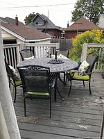 Full set on deck showing table and five chairs
