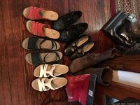 Group shot of all six pairs of shoes on wooden floor