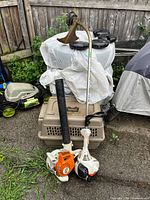 Both Stihl tools standing together showing overall condition