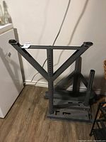 Full view of grey metal underframe standing upright