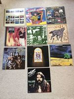 All ten album covers laid out on carpet