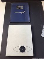 Both books closed, front covers visible