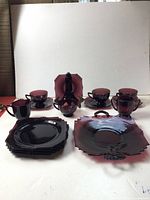 Entire set arranged showing cups, saucers, plates, platter, creamer, sugar bowl